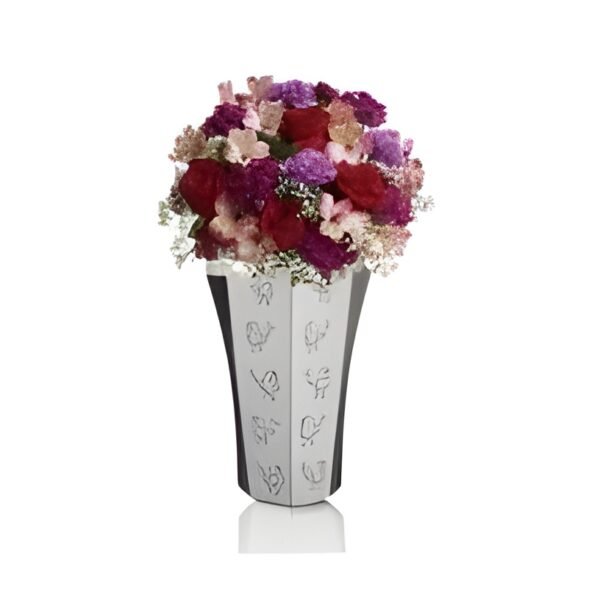 The Ferragaml Flower Vase, a true marvel of Indian craftsmanship, embodies elegance and tradition. Crafted with meticulous attention to detail, it showcases intricate designs inspired by India's rich heritage. This masterpiece seamlessly blends artistry and functionality, adding a touch of regal charm to any space. A testament to India's artistic finesse, it captivates with its timeless beauty.