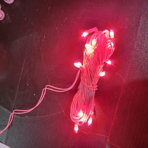 a decorative lighting product with warm pink LED lights attached to a wire. It's often used for creating a cozy and enchanting ambiance in various settings. The wire allows for flexible and creative placement of the lights, making it suitable for decorating both indoor and outdoor spaces.